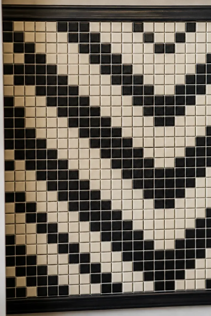 Small square mosaic pattern on wall made from peel-and-stick vinyl tiles