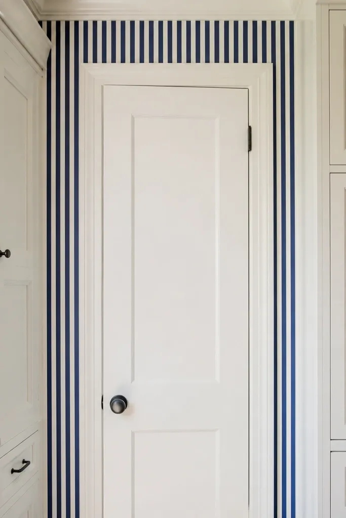 Blue stripe wall panel behind pantry area with light cabinets nearby